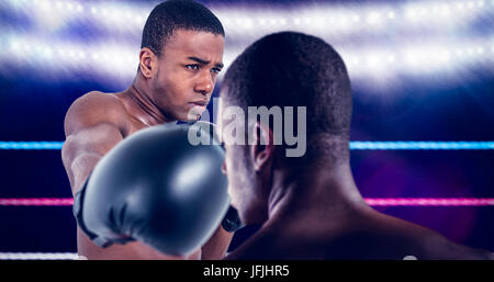 Composite image of rear view of boxer standing Stock Photo