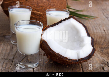 Coconut milk and shells Stock Photo