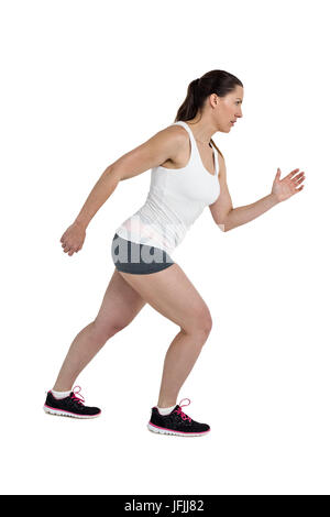 Side view of energetic female athlete running Stock Photo