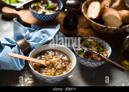 Chickpea soup  Revithia and vegetable stew Briam on the stone background horizontal Stock Photo