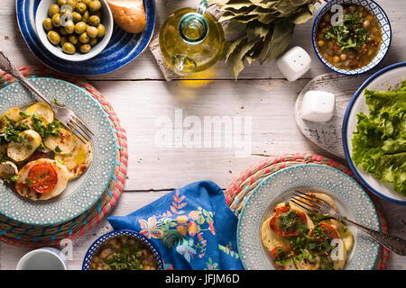 Chickpea soup  Revithia and vegetable stew Briam on the white table top view horizontal Stock Photo