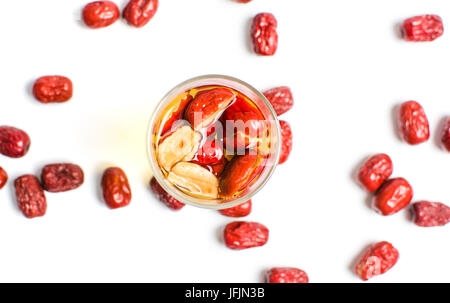 Chinese red dates fruit tea in a glass on white Stock Photo