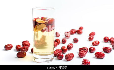 Chinese red dates fruit tea in a glass on white Stock Photo