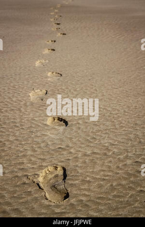 Footsteps in the sand Stock Photo