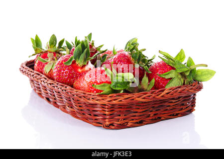 Wicker tray with strawberries on a white background Stock Photo