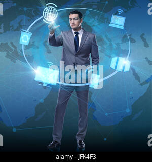 Businessman pressing buttons in computing concept Stock Photo