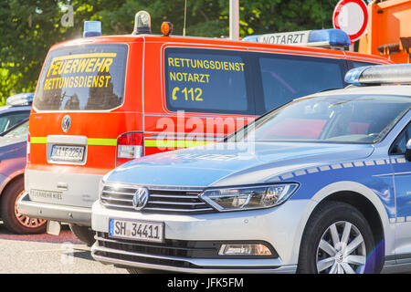 KIEL / GERMANY - JUNE 20, 2017: german police and an ambulance car stands on public event Kieler Woche. Stock Photo