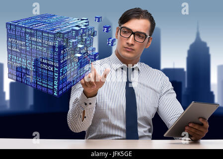 Businessman with tablet computer pressing buttons Stock Photo