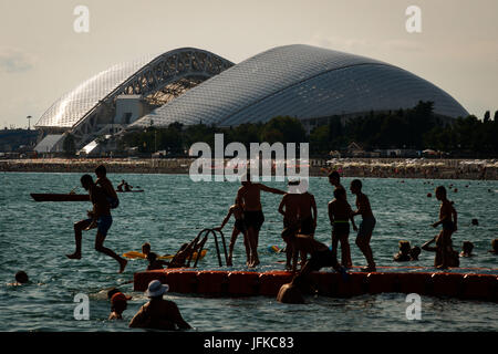 SOCHI, SC - 30.06.2017: GENERAL PHOTOS SOCHI 2017 - Moving in the city of Sochi, one of the four venues of the 2017 Confederations Cup and 2018 World Cup in Russia. In the photo, the Fisht Stadium (Olympic Stadium of Sochi) and bathers on the beach in front of the stadium. (Photo: Marcelo Machado de Melo/Fotoarena) Stock Photo