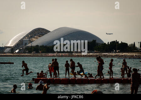 SOCHI, SC - 30.06.2017: GENERAL PHOTOS SOCHI 2017 - Moving in the city of Sochi, one of the four venues of the 2017 Confederations Cup and 2018 World Cup in Russia. In the photo, the Fisht Stadium (Olympic Stadium of Sochi) and bathers on the beach in front of the stadium. (Photo: Marcelo Machado de Melo/Fotoarena) Stock Photo