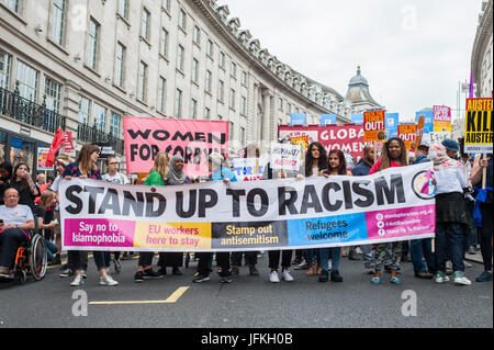 London, UK. 01st July, 2017. Demonstrators carry placards during the 'Not One Day More' march past Piccadilly Circus on July 1, 2017 in London, England. Thousands of protesters joined the anti-Tory demonstration at BBC Broadcasting House and marched to Parliament Square. The demonstrators were calling for an end to the Conservative Government and policies of austerity Credit: onebluelight.com/Alamy Live News Stock Photo