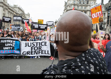 London, UK. 1st July, 2017. Justice for Grenfell campaigners among thousands of people from many different campaign groups and trade unions marching through London on the Not One More Day national demonstration organised by the People's Assembly Against Austerity in protest against continuing austerity, cuts and privatisation and to call for a properly funded health service, education system and housing. A minute's silence was also held for the victims of the fire at Grenfell Tower. Credit: Mark Kerrison/Alamy Live News Stock Photo