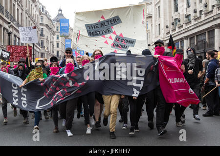 London, UK. 1st July, 2017. Anti-capitalists among thousands of people from many different campaign groups and trade unions marching through London on the Not One More Day national demonstration organised by the People's Assembly Against Austerity in protest against continuing austerity, cuts and privatisation and to call for a properly funded health service, education system and housing. A minute's silence was also held for the victims of the fire at Grenfell Tower. Credit: Mark Kerrison/Alamy Live News Stock Photo