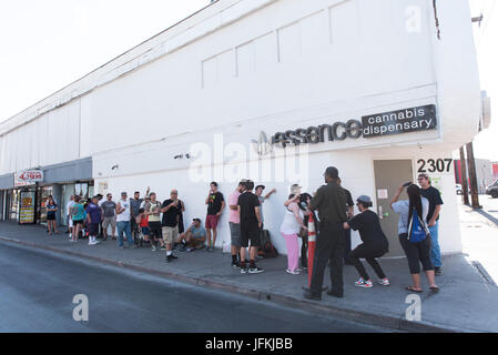 Las Vegas, USA. 01st July, 2017. customers wait for Essence Cannabis Dispensary to open during the first day of the state's recreational marijuana sales. State residents and visitors over the age of 21 are able to purchase up to one ounce of marijuana flower and 1/8 ounce of concentrate. Credit: Jason Ogulnik/Alamy Live News Stock Photo