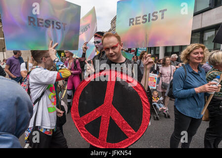 July 1, 2017 - London, UK - London, UK. 1st July 2017. 'Resist' is the message from these protesters at the start of the large march which met at the BBC and marched to Parliament Square calling for Theresa May and the Conservatives to go. Her snap election failed to deliver a majority and we now have a government propped up the DUP, a deeply bigoted party with links to Loyalist terrorists and bribed to support her. The election showed a rejection of her austerity austerity policies and the Grenfell Tower disaster underlined the toxic effects of Tory failure and privatisation of building regul Stock Photo
