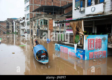 Shaoyang, Shaoyang City of central China's Hunan Province. 2nd July, 2017. A boat patrols to rescue stranded people on a street of Xinshao County, Shaoyang City of central China's Hunan Province, July 2, 2017. Recently Shaoyang witnessed the heaviest flood this year. Credit: Lyu Jianshe/Xinhua/Alamy Live News Stock Photo