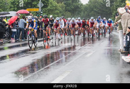 Korschenbroich, Germany. 02nd July, 2017. Numerous fans standing in the rain at the entrance to the town of Korschenbroich and cheering the arrival of the peloton during the Dusseldorf-Luttich stretch, the 2nd stage of the Tour de France, part of the UCI World Tour, 02 July 2017. Photo: Guido Kirchner/dpa/Alamy Live News Stock Photo