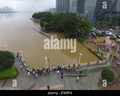 Changsha, China's Hunan Province, China. 2nd July, 2017. Citizens are seen in flood-hit Changsha, capital of central China's Hunan Province, July 2, 2017. Days of torrential rain in Hunan Province raised the water level of the Xiangjiang River, a major tributary of Yangtze River, to exceed its record flood level Sunday morning. Credit: Long Hongtao/Xinhua/Alamy Live News Stock Photo