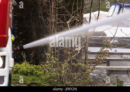 Fire department sprayed extinguishing water during an exercise. Stock Photo