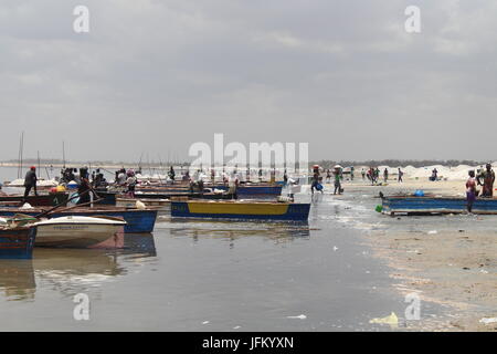 Salt workers and their boats on Lake Retba, Pink Lake, Lac Rose, outside Dakar, Senegal Stock Photo