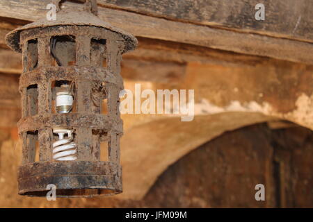 Iron lamp hanging from the roof inside "the slave house" on Goree Island, Dakar Stock Photo