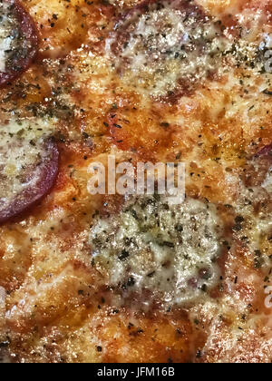 salami pizza in closeup for textures Stock Photo