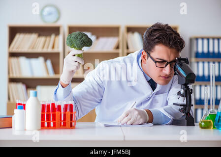 Scientist working on organic fruits and vegetables Stock Photo