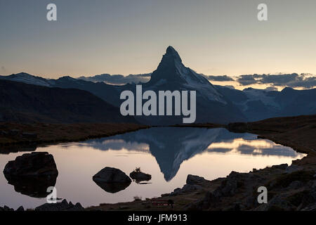 The Matterhorn reflected in lake stellisee the last light of sunset, Zermatt valley, Valais-Wallis Canton, Switzerland Stock Photo