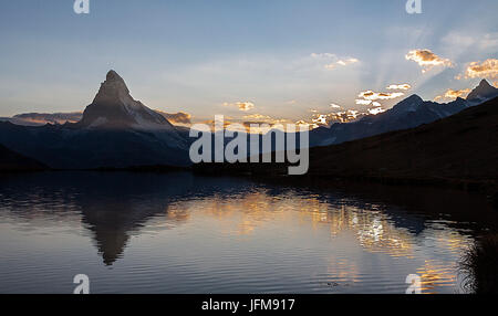 The Matterhorn reflected in lake stellisee the last light of sunset, Zermatt valley, Valais-Wallis Canton, Switzerland Stock Photo