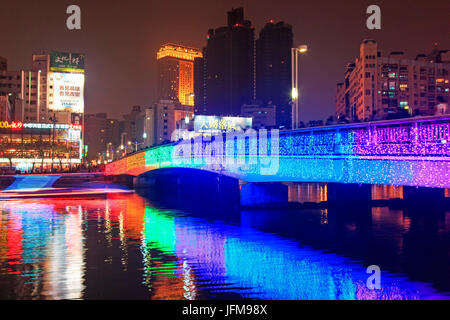 Kaohsiung, Taiwan, People walking on the bridge by the Love River of Kaohsiung during the celebrations for the Chinese new year, The Chinese New Year is an important Chinese festival celebrated at the turn of the Chinese calendar, In China, it is also known as the Spring Festival, the literal translation of the modern Chinese name, Stock Photo