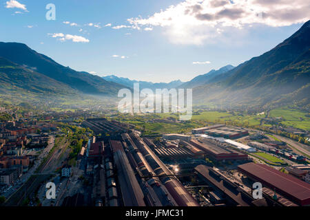 Aerial view of Aosta city, in the foreground Steel Factory, Aosta Valley, Italy, Europe, Stock Photo