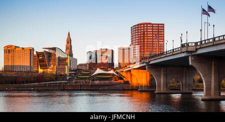 USA, Connecticut, Hartford, city skyline with Connecticut Science Center and Travelers Building, from the Connecticut River, dawn, autumn Stock Photo