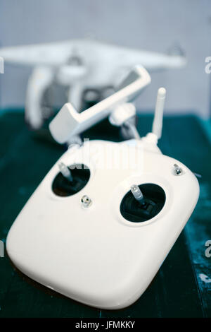 Top view of a remote controller for drone with a blurred copter in the background Stock Photo