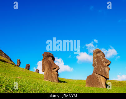 Moais at the quarry on the slope of the Rano Raraku Volcano, Rapa Nui National Park, Easter Island, Chile Stock Photo