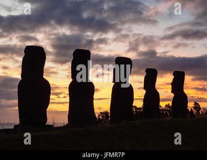 Moais in Ahu Akivi at sunset, Rapa Nui National Park, Easter Island, Chile Stock Photo