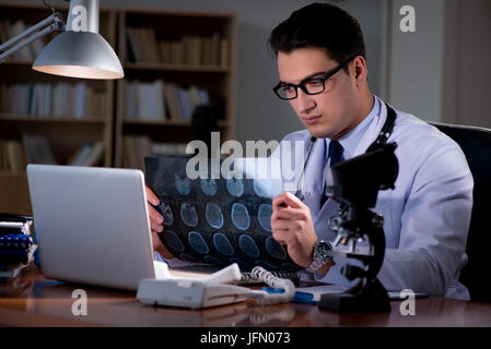 The young doctor working late in the office
