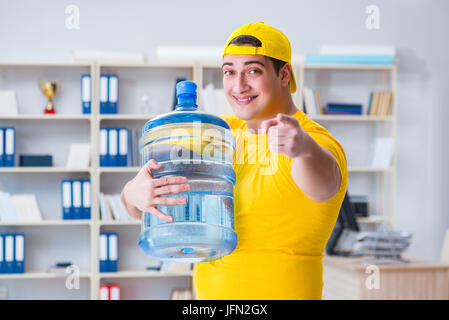 The man delivering water bottle to the office Stock Photo