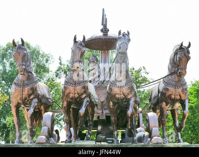 Giant Krishna-Arjuna chariot made of bronze metal, situated at Brahma Sarovar Kurukshetra, Haryana, is a big charm for the pilgrims. Stock Photo