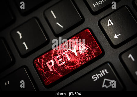 Message on broken red enter key of keyboard. Computer petya virus attack. Copy space Stock Photo
