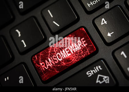 Message on broken red enter key of keyboard. Computer ransomeware virus attack. Copy space Stock Photo