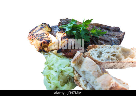 Fresh grilled meats variety meats with bread and coleslaw. Stock Photo