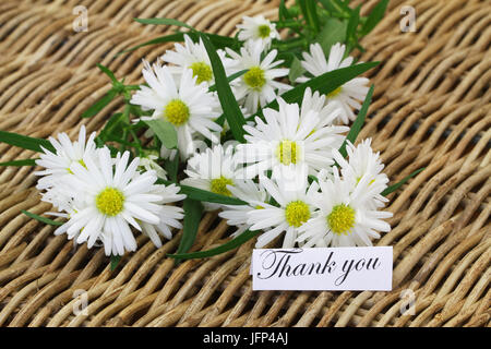 Thank you card with white daisies on wicker surface Stock Photo