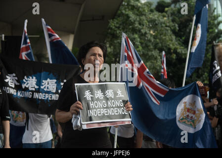 Hong Kong. 01st July, 2017. Pro-democracy protesters carrys a large ...