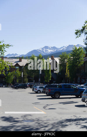 View of snow capped rockies from Whistler's Upper Village market place. Stock Photo