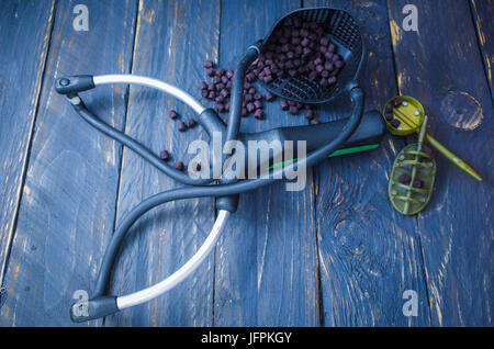 Steel, sport fishing slingshot with triple harness. Hunting slingshot on a  white background. Slingshot made of metal with elastic bands Stock Photo -  Alamy