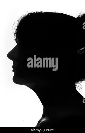 Black and white female silhouette simply created by standing in front of a softbox Stock Photo