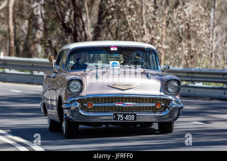 Vintage 1957 Chevrolet Belair Sports Sedan driving on country roads near the town of Birdwood, South Australia. Stock Photo