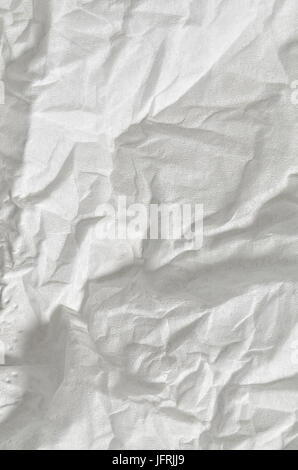 close up of a creased, white, soft paper texture, full frame, vertical Stock Photo