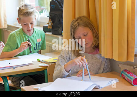 primary school children working with their compasses Stock Photo - Alamy