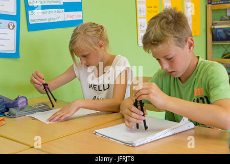 pupils at primary school working with their compasses Stock Photo - Alamy